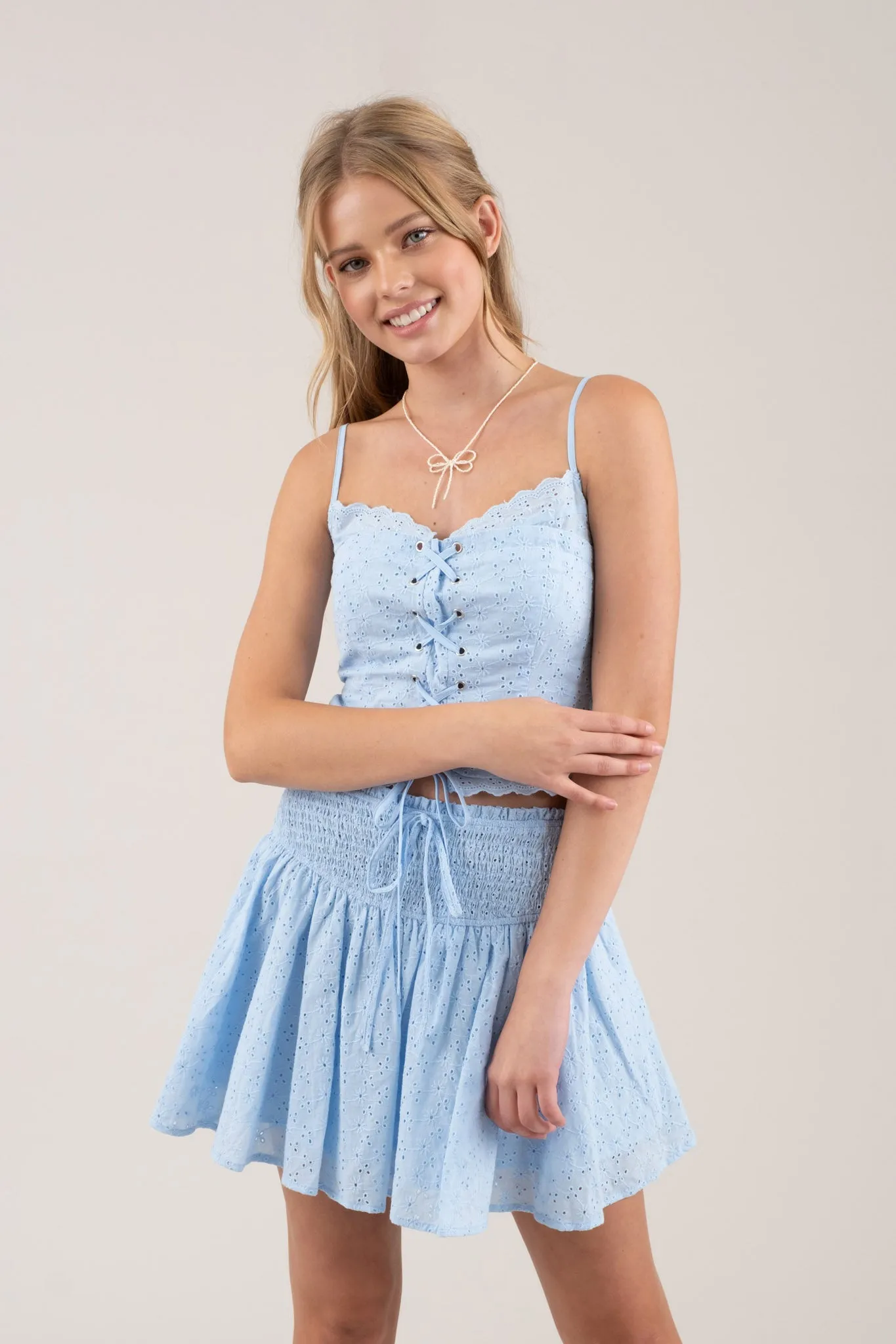 EMBROIDERED EYELET SMOCKED MINI SKIRT